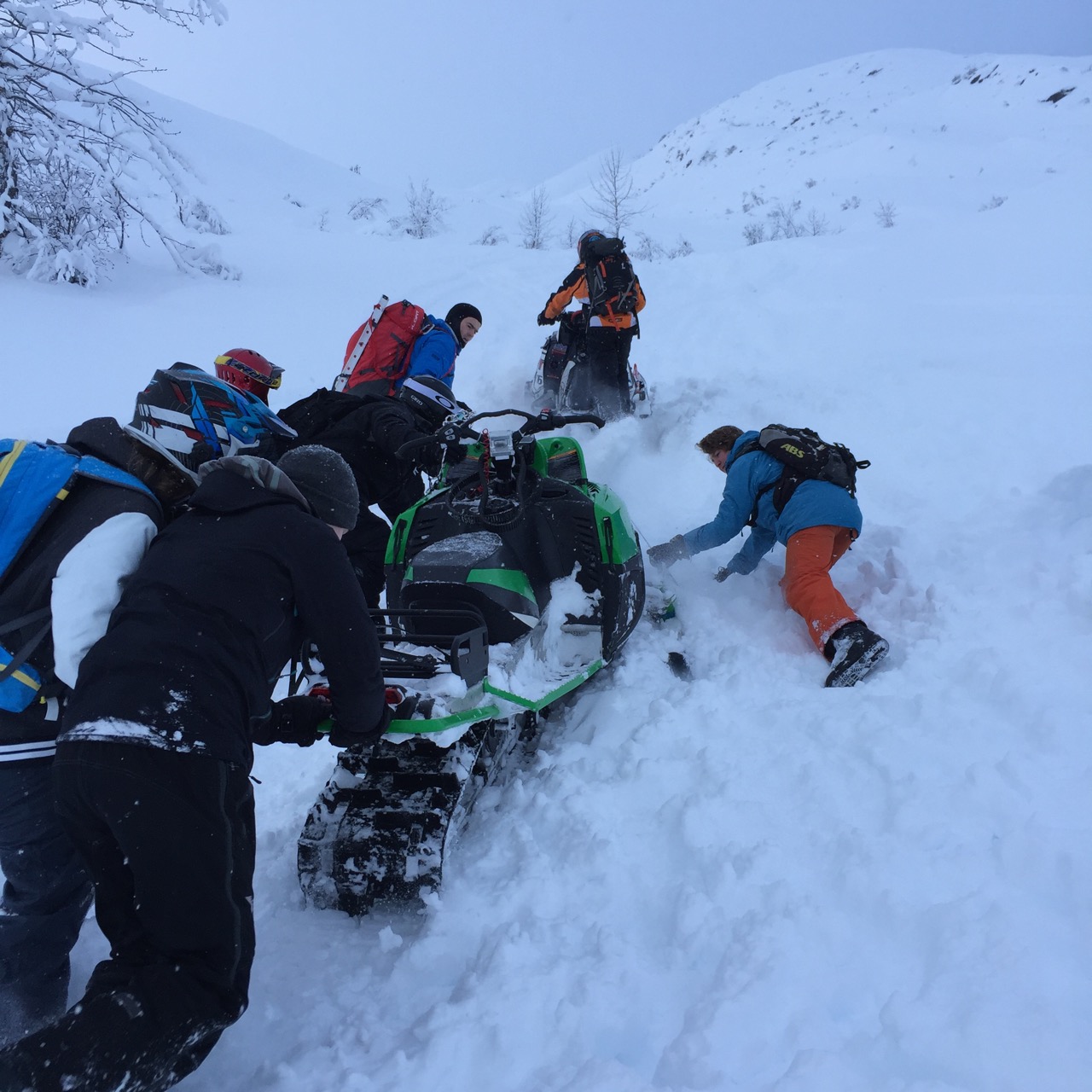Towing a stuck sled, Photo by Mike Buck